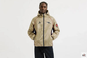 Veste coupe-vent rétro dorée d’Arsenal The Urban Hawk