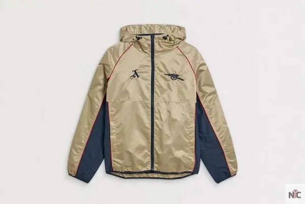Veste coupe-vent rétro dorée d’Arsenal The Urban Hawk